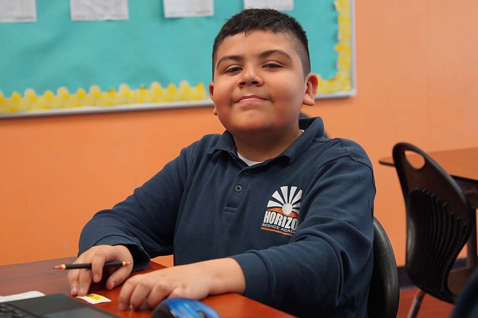 students and teacher working in classroom